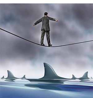 Man on tightrope over sharks
